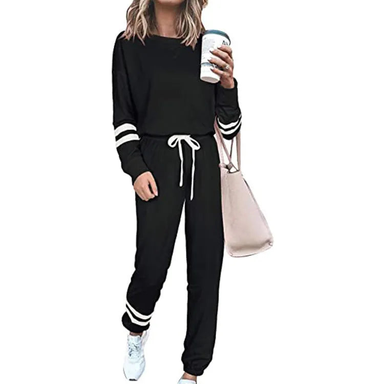 Women's plus size casual two-piece suit set in a solid colour, showing loose-fitting long sleeve top and trousers.