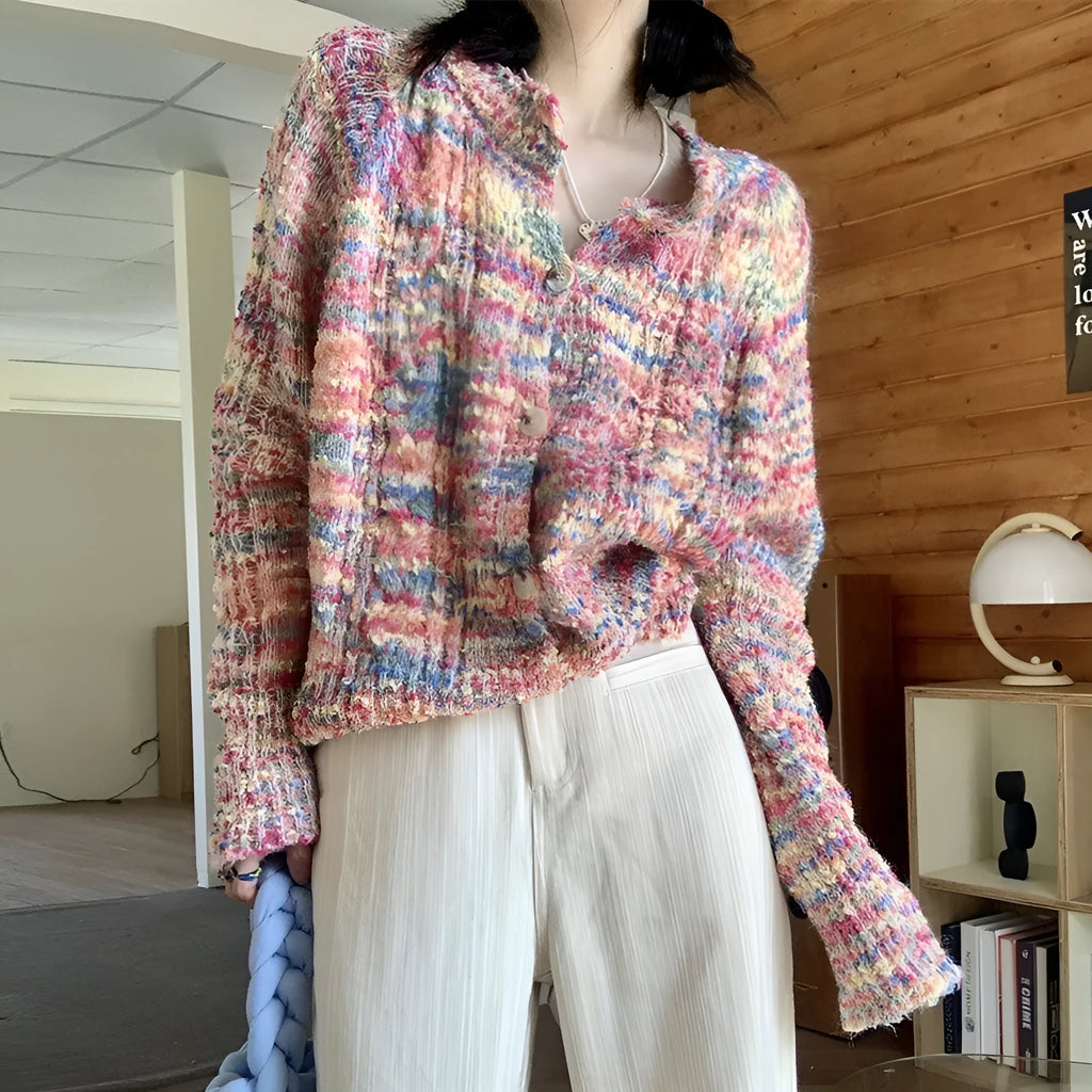 Retro slim fit pink knitted cardigan with regular sleeves on a hanger