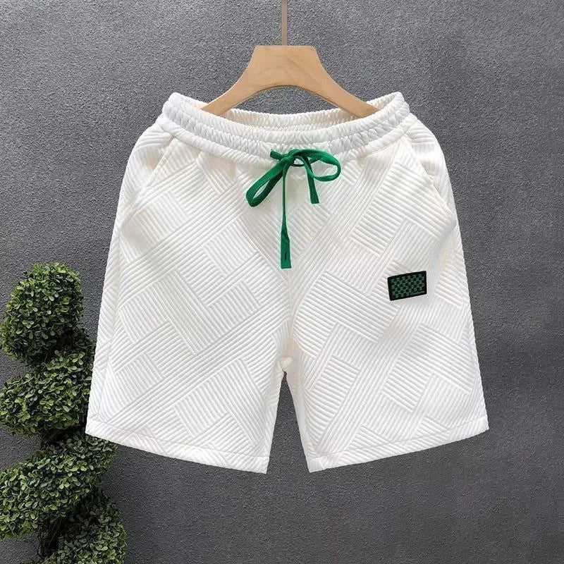 Casual polyester sports shorts with micro elasticity in black, white or green colours
