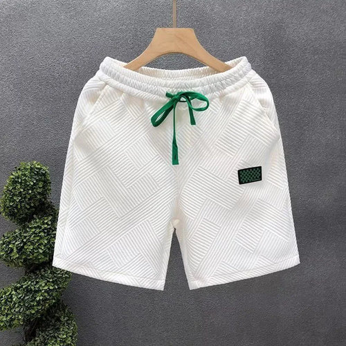 Casual polyester sports shorts with micro elasticity in black, white or green colours