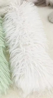 Green, white, blue, and pink plush cat toy pillow measuring 27 by 10 centimetres.