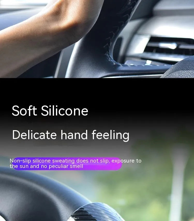 Black silicone steering wheel assist ball with metal bearing mounted on car steering wheel