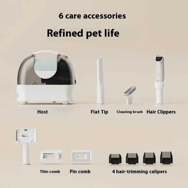 Pink and white pet hair vacuum cleaner with grooming attachments including an electric shear on a flat surface.