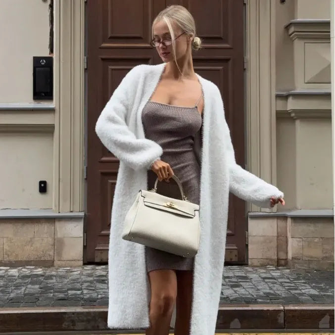 White longline knitted cardigan for women with a loose fit and long sleeves.