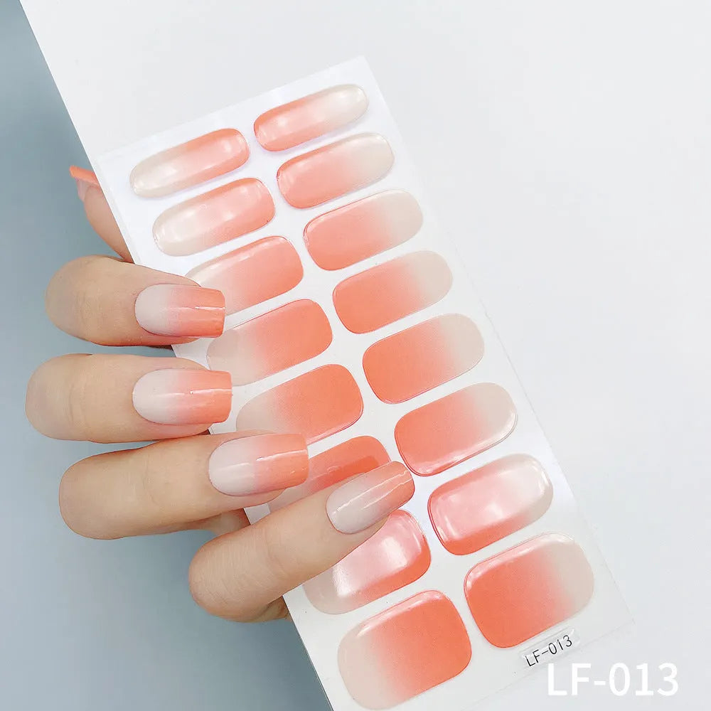 Set of 16 solid colour full nail art stickers showing patterns like cross, rose, tulip, and cartoon designs.
