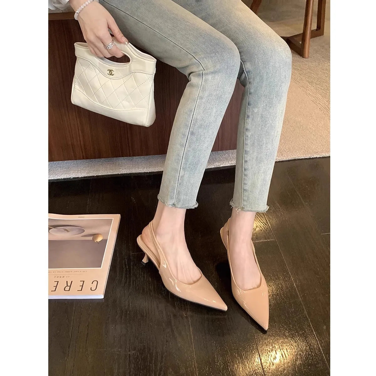 Women's pointed toe stiletto high heel pumps in black and nude with microfiber upper