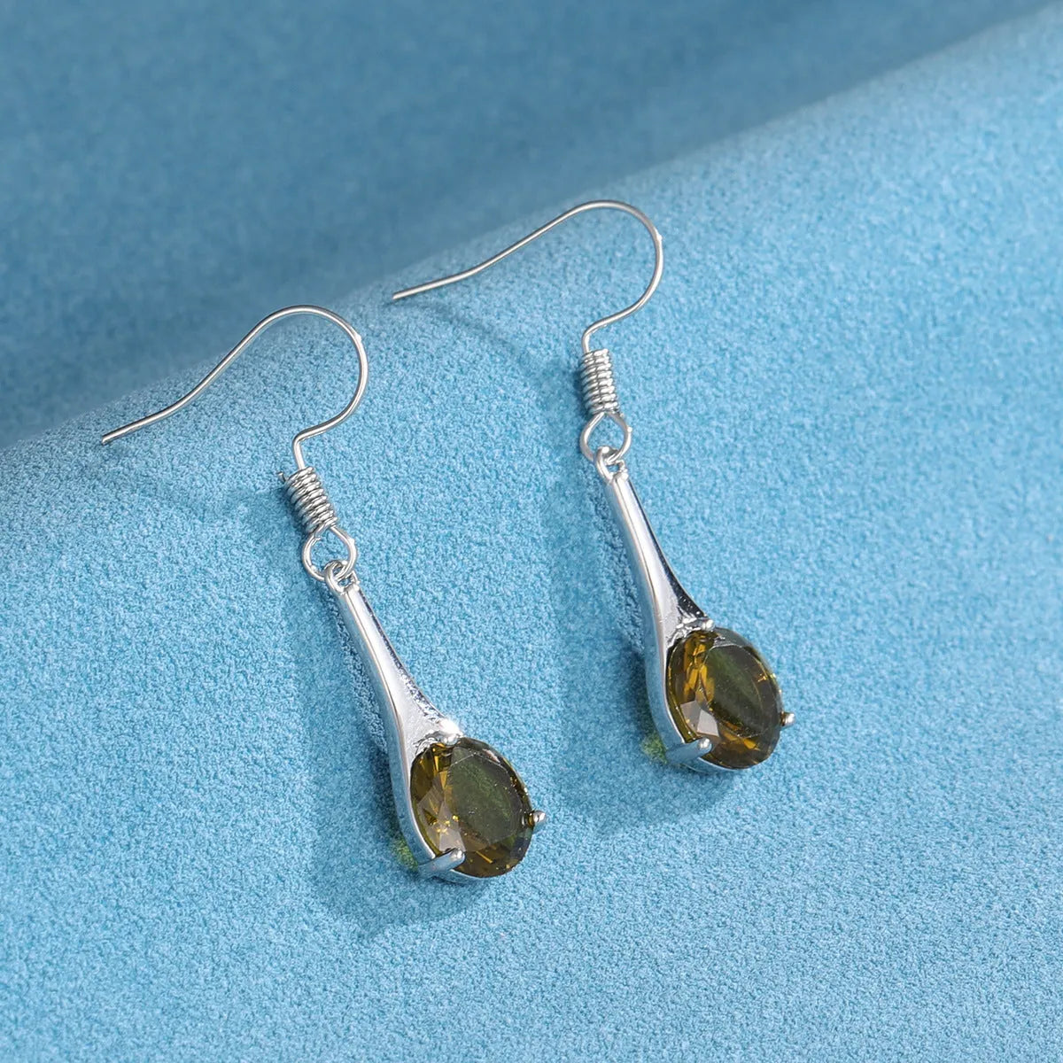 Olive green topaz earrings with water drop shape and retro style design