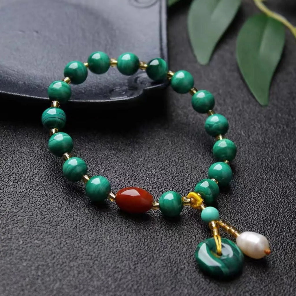Natural malachite bracelet with southern red agate barrel beads showing green and red stone details