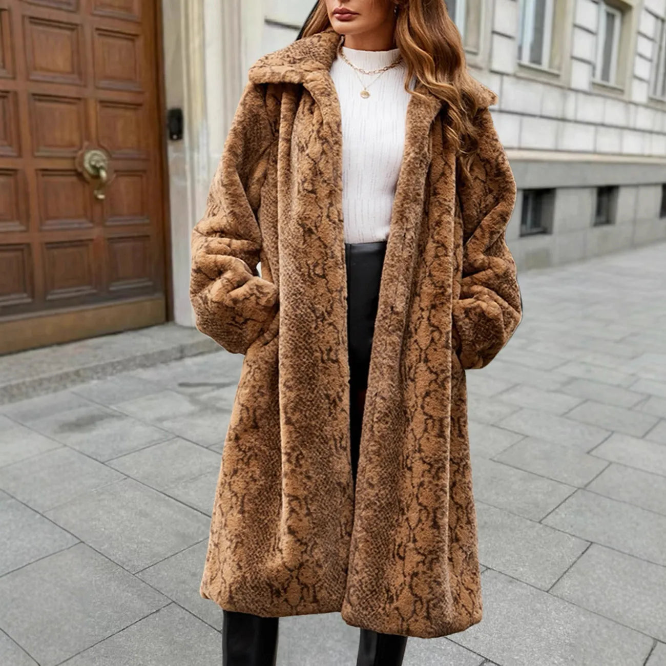 Women's long faux fur coat in leopard print showing regular sleeves and 80cm length.