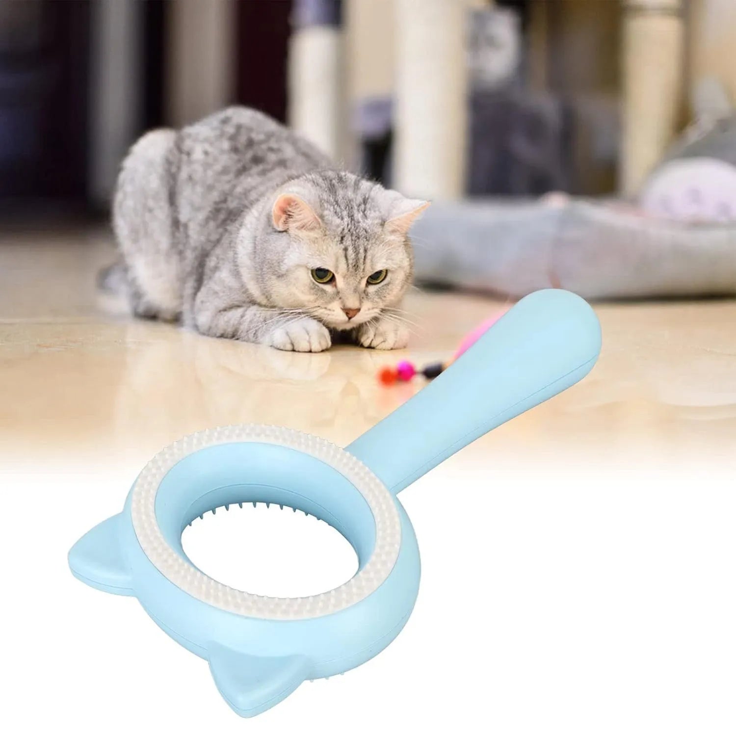 Blue and white double-sided pet grooming brush with ergonomic handle for cats and dogs.