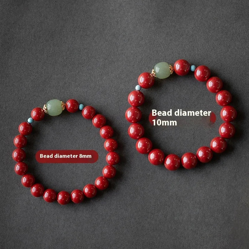 Purple gold sand cinnabar and Hetian jade geometric ellipse bead unisex bracelet on a wrist.