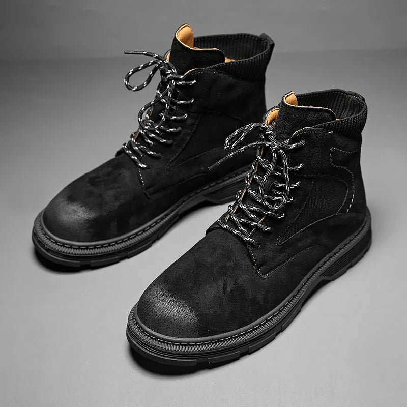 Men's vintage Martin boots in black with a round toe and low thick heel on a rubber sole.