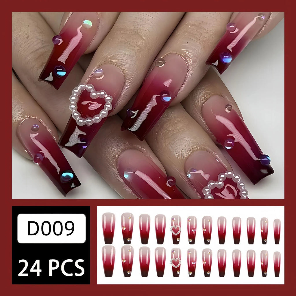 Wine red gradient fake nail tips with plaid pattern in long ballet style displayed with jelly glue applicator