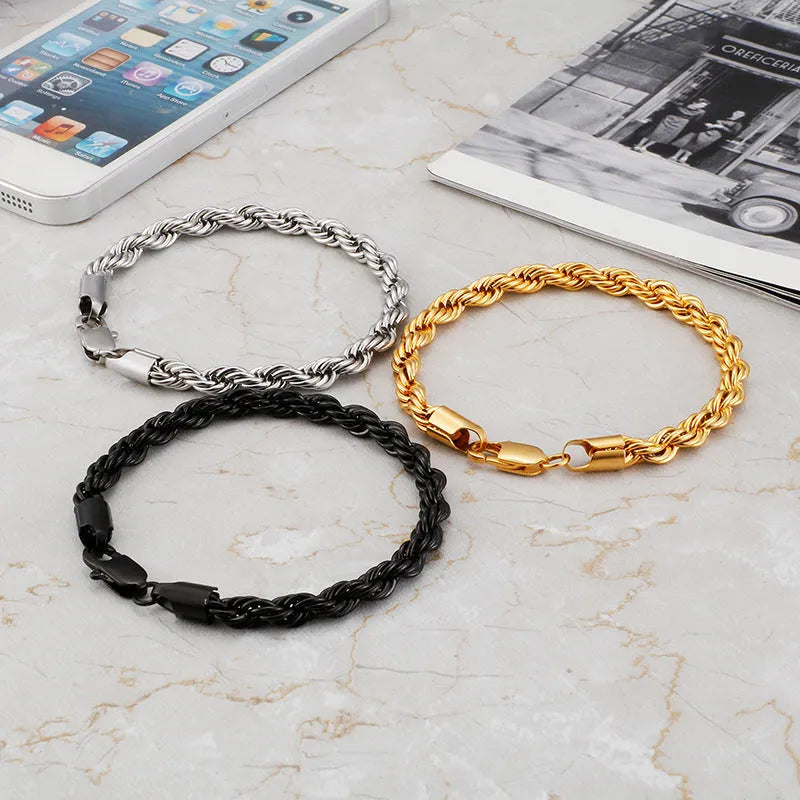 Gold double colour twist chain titanium steel bracelet with geometric design on white background