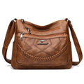Women's black PU leather crossbody shoulder bag with large capacity and zipper compartment
