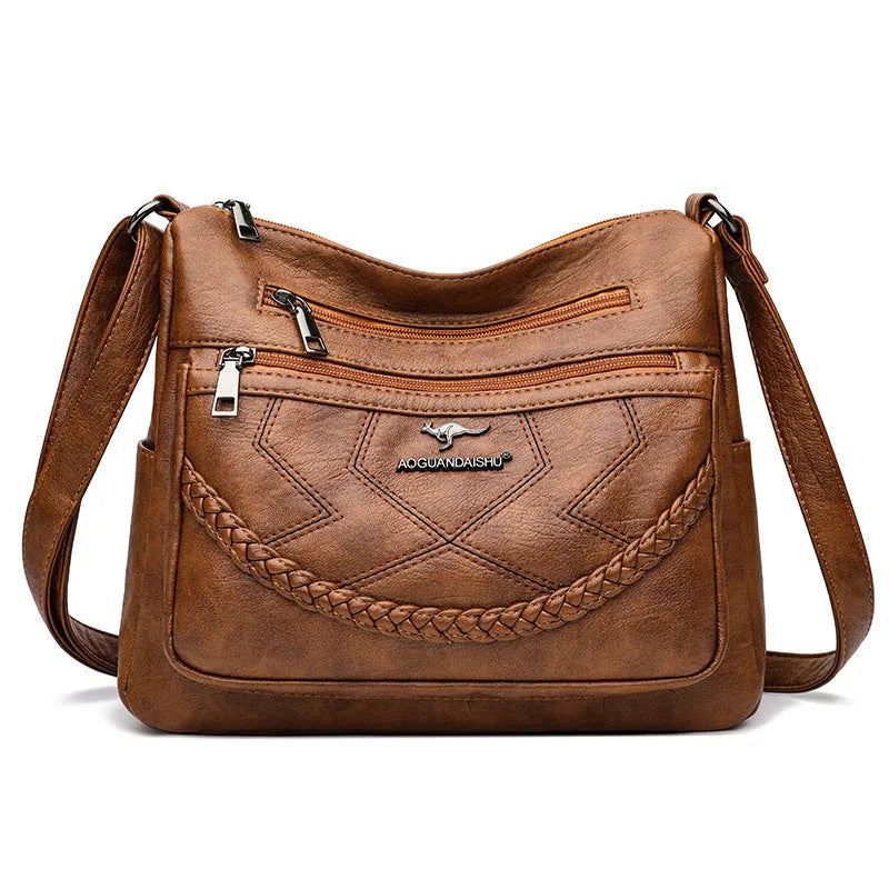 Women's black PU leather crossbody shoulder bag with large capacity and zipper compartment
