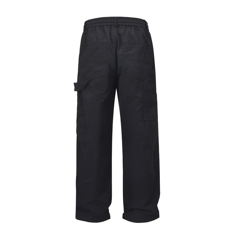 Black paratrooper trousers with elastic waistband and three-dimensional cutting in baggy fit style
