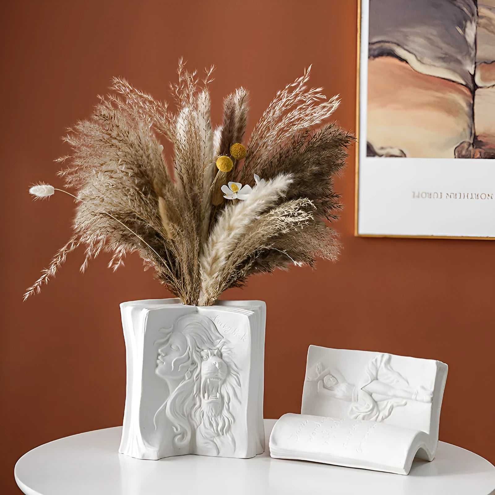 Glazed ceramic book stand in one of four artistic styles: lover, dancer, beauty and beast, or brushed face.