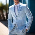 Blue men's British-style suit jacket with white double buttons and straight hem.
