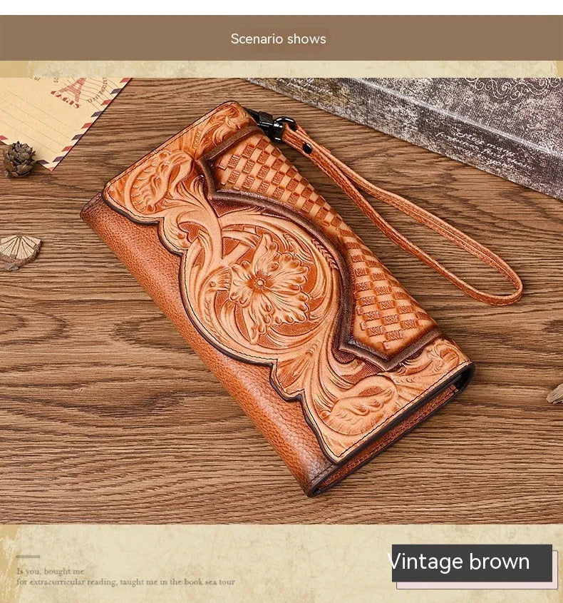 Women's brown tri-fold leather wallet with embossed floral pattern showing open compartments