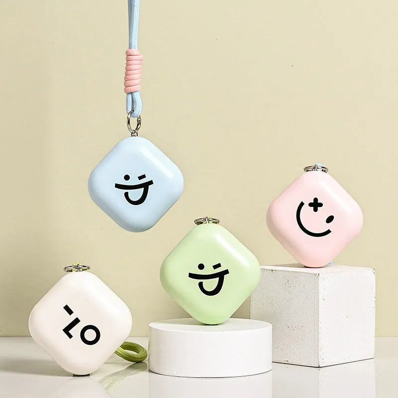 Square rechargeable hand warmer in white, light green, and pink colours with USB charging