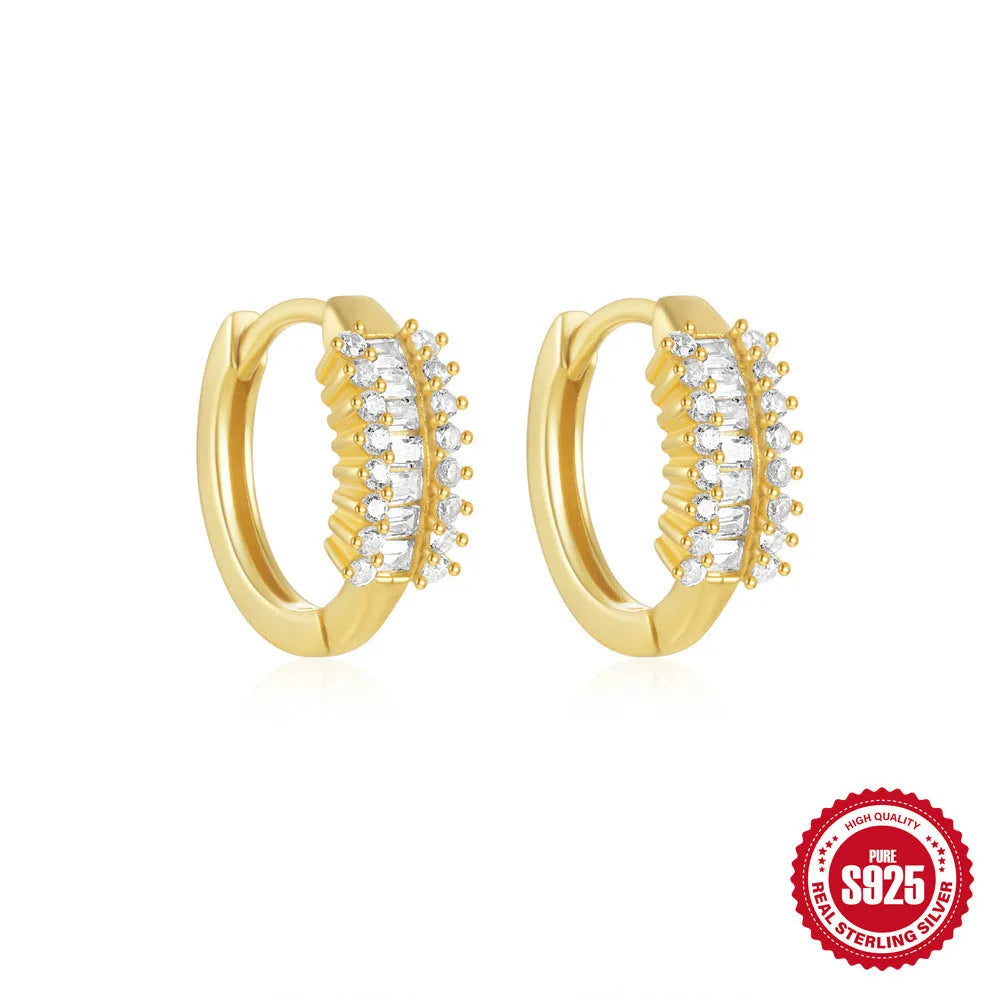 Small round geometric sterling silver stud earrings in gold and silver electroplated finishes.