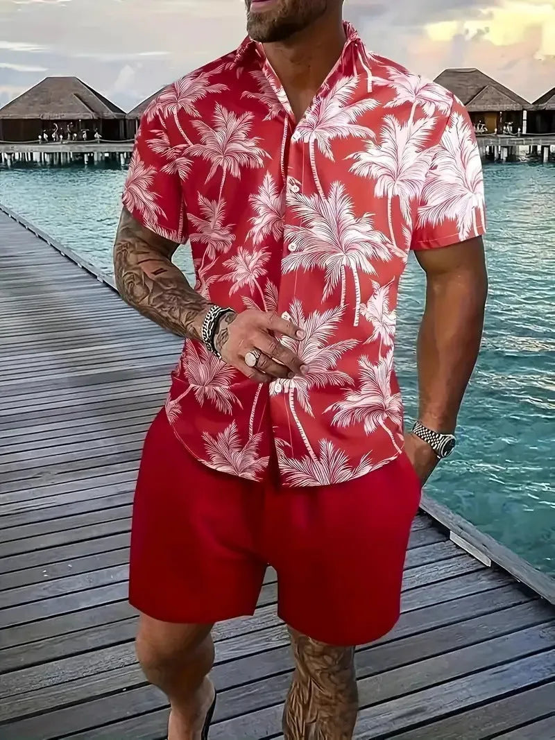 Man wearing a blue Hawaiian print short sleeve shirt and matching shorts from the casual suit set.