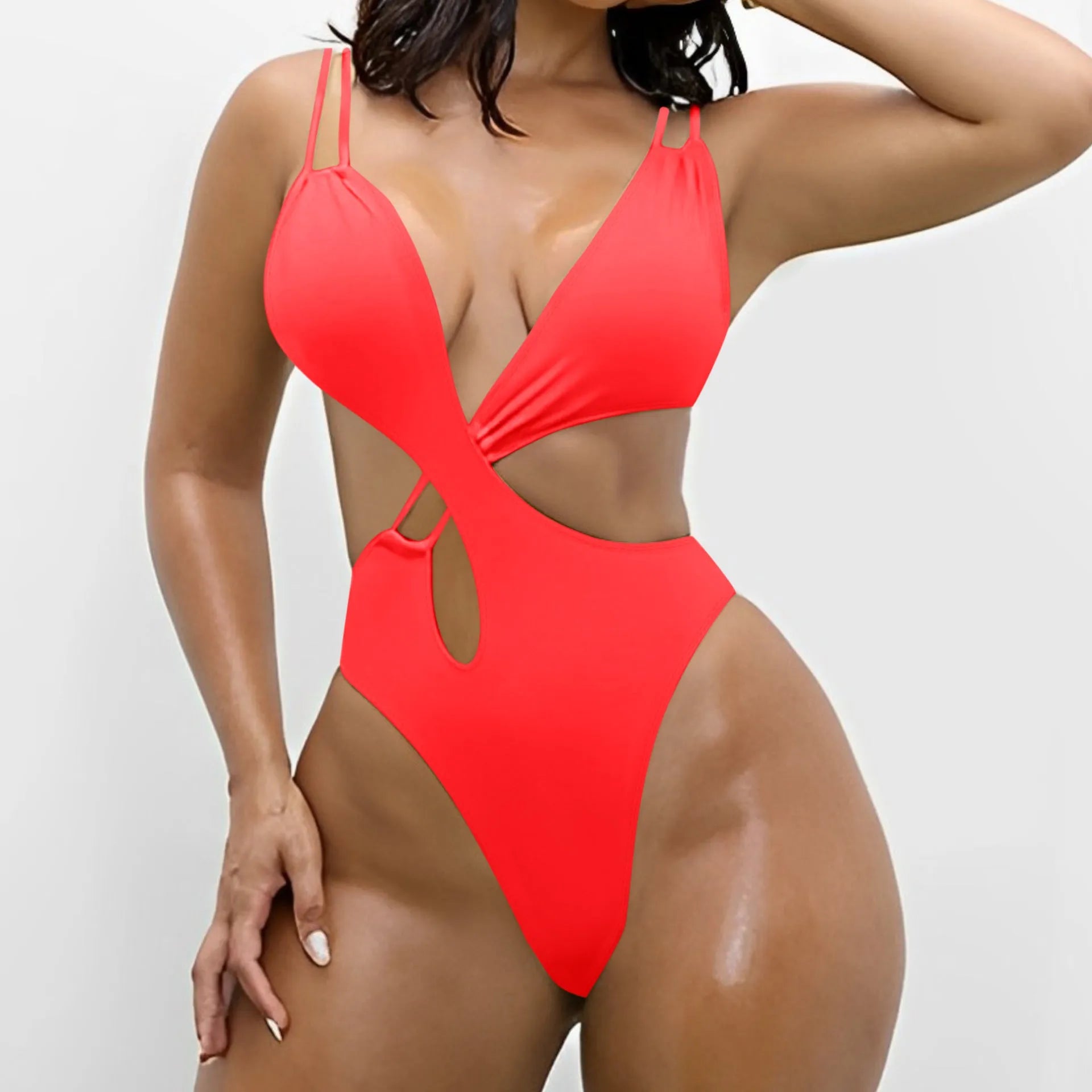 Women's solid colour backless one-piece swimsuit with triangle bikini top in nylon fabric.