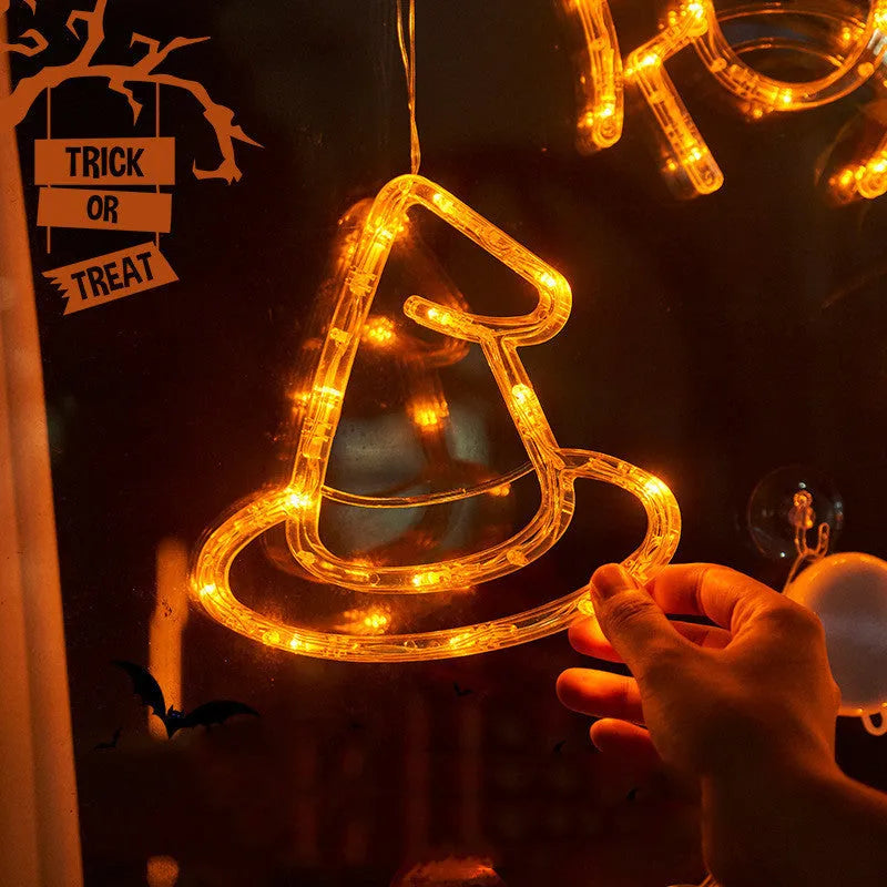 Seven Halloween LED window lights with spider, pumpkin and ghost designs on suction cups