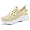 Women's white Flyknit running sneakers with round toe, flat heel, and thick PVC sole on a light background.