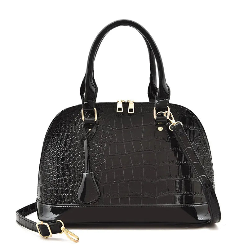 Large shiny black PU crossbody bag with a structured shell shape