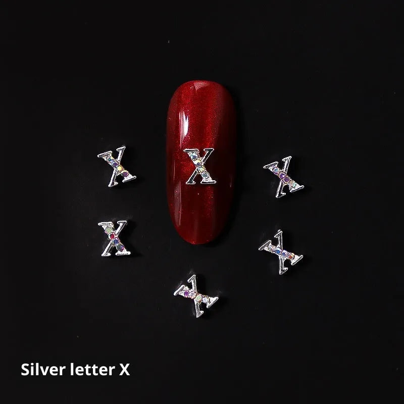 Gold alloy letter A nail ornament charm with crystal detail on a square chain base