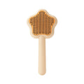 Large green self-cleaning cat comb magic wand with stainless steel needle teeth for pet grooming.
