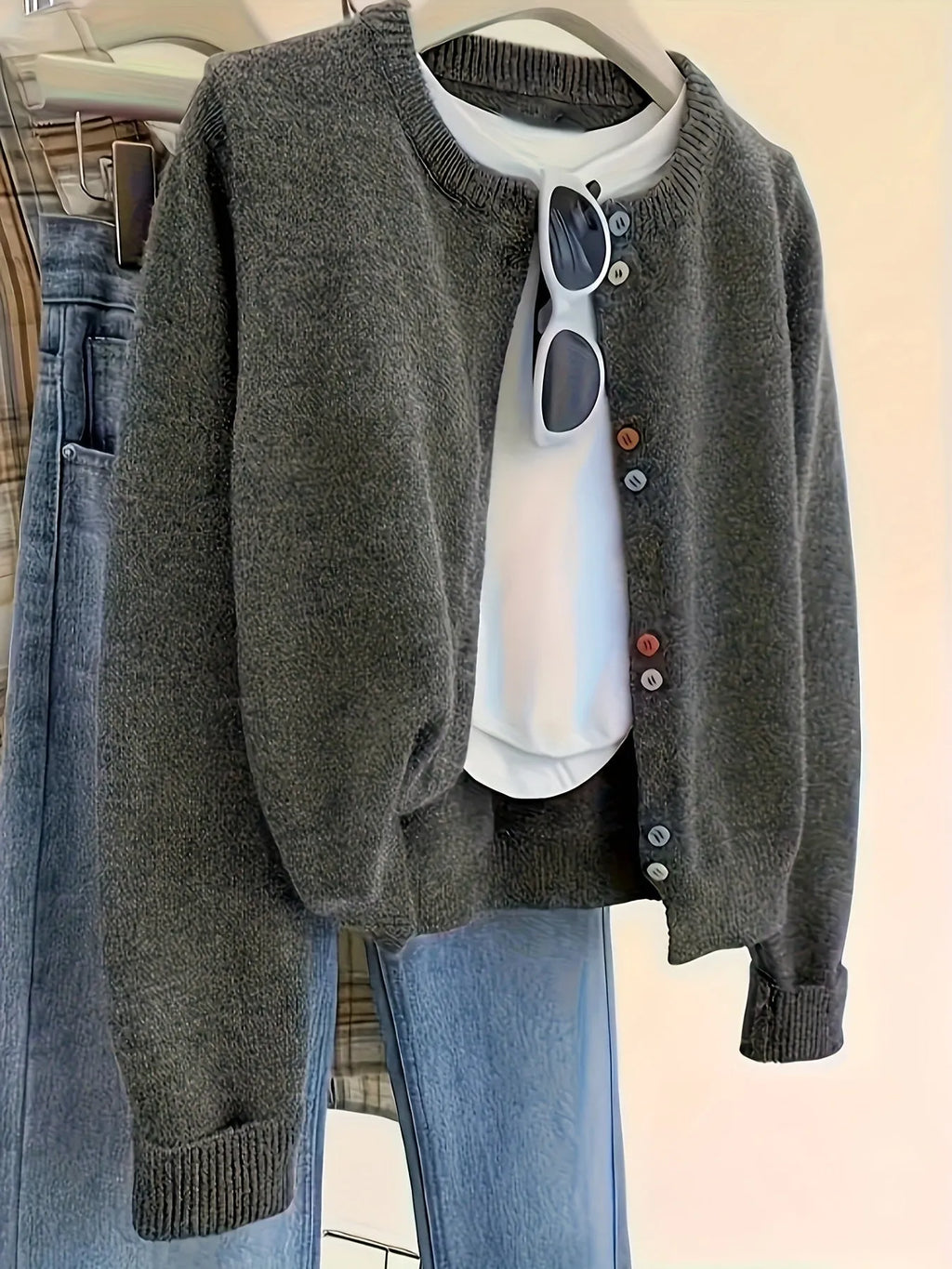 Women's dark grey solid colour polyester cardigan with button front and long sleeves.