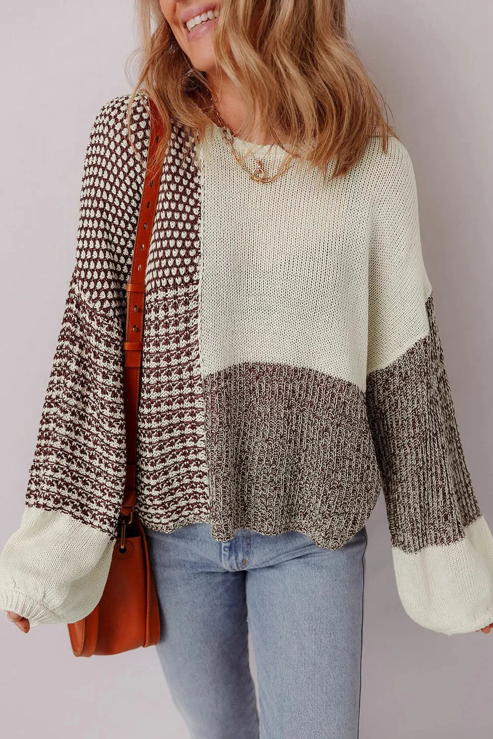Dark khaki loose sweater with drop shoulders and a back tie fastening.