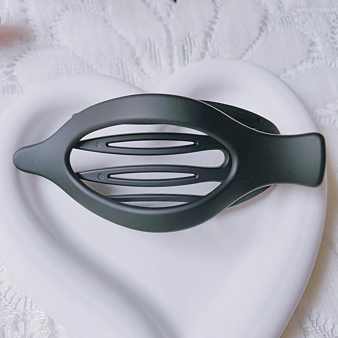 Set of six nude-coloured plastic hair clips with frosted grip finish and quadrilateral shape
