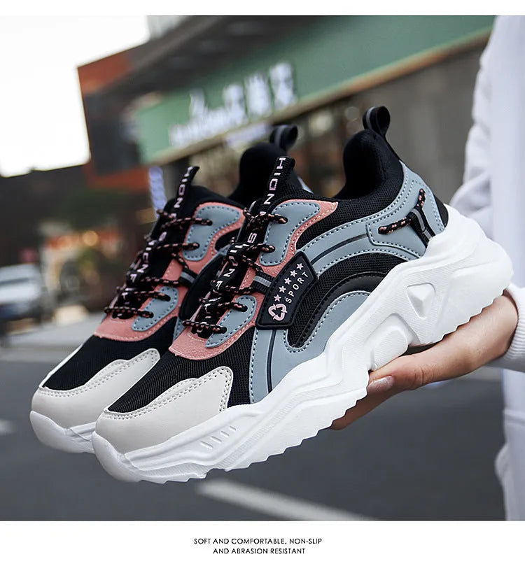 Women's white thick-soled casual sports shoes with mesh upper, round toe, and buckle closure.