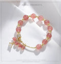 Pink adjustable women's bracelet with heart-shaped strawberry quartz crystal and freshwater pearl accents