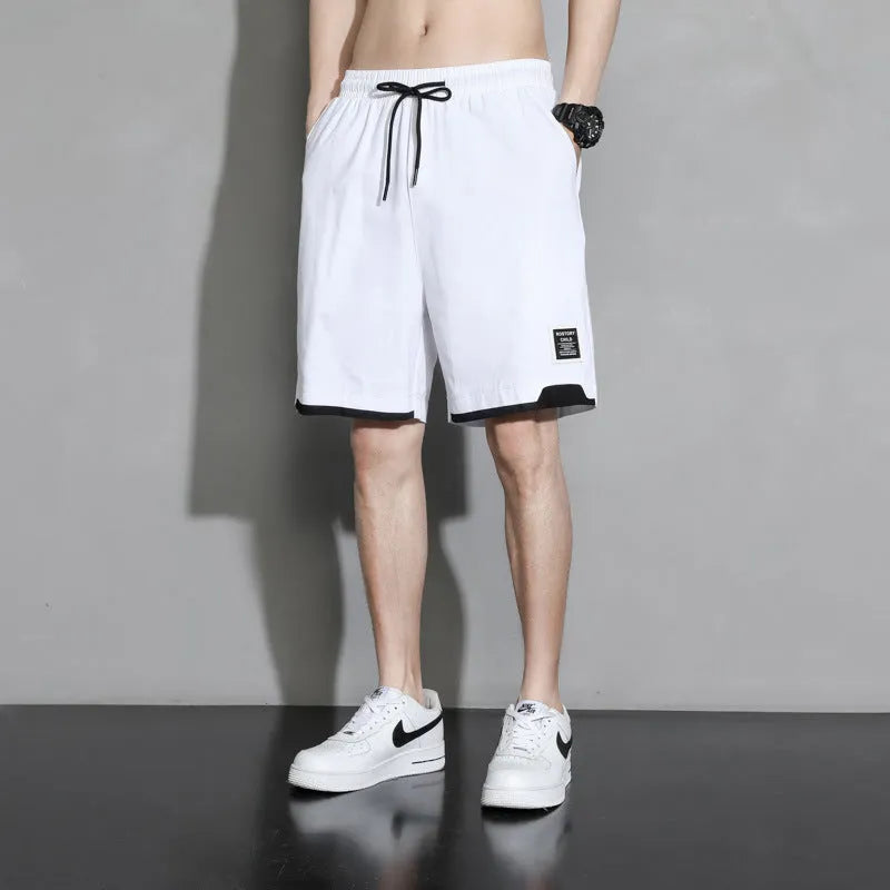 Boys cotton shorts in black, shown in a casual setting for summer.