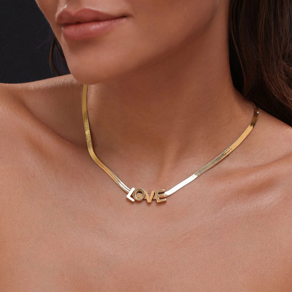 Gold electroplated titanium steel necklace with the letter 'A' pendant on a 40.5cm chain.