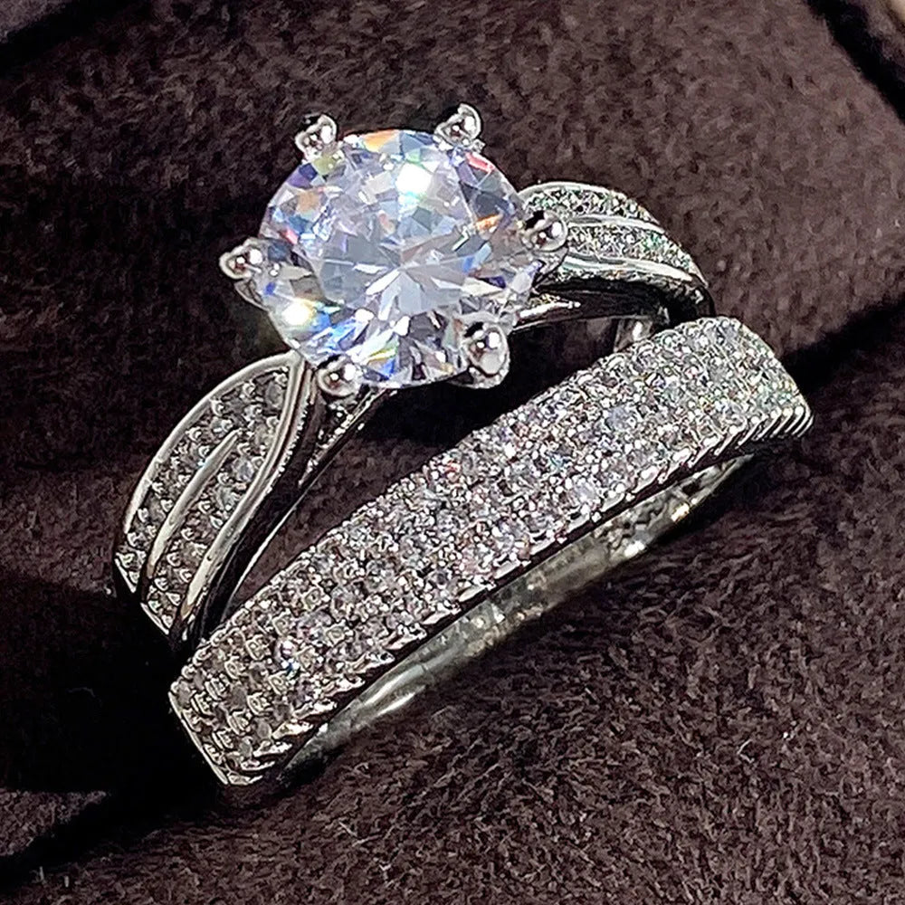 White gold geometric wedding ring bracelet with round elements on hand