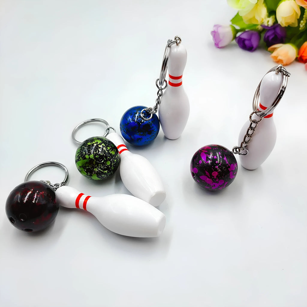 Mini bowling pin keychain pendant in four colour options with key ring attachment