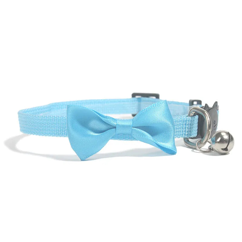 Adjustable striped nylon cat collar with a small bell, shown in multiple colour options on a white background.