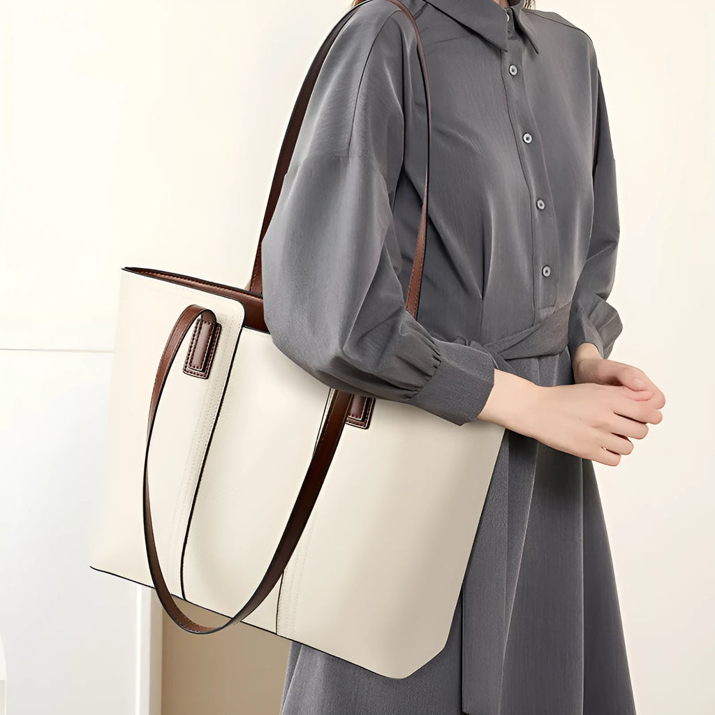Women's black genuine leather crossbody bag with internal organiser compartments showing document and phone sections