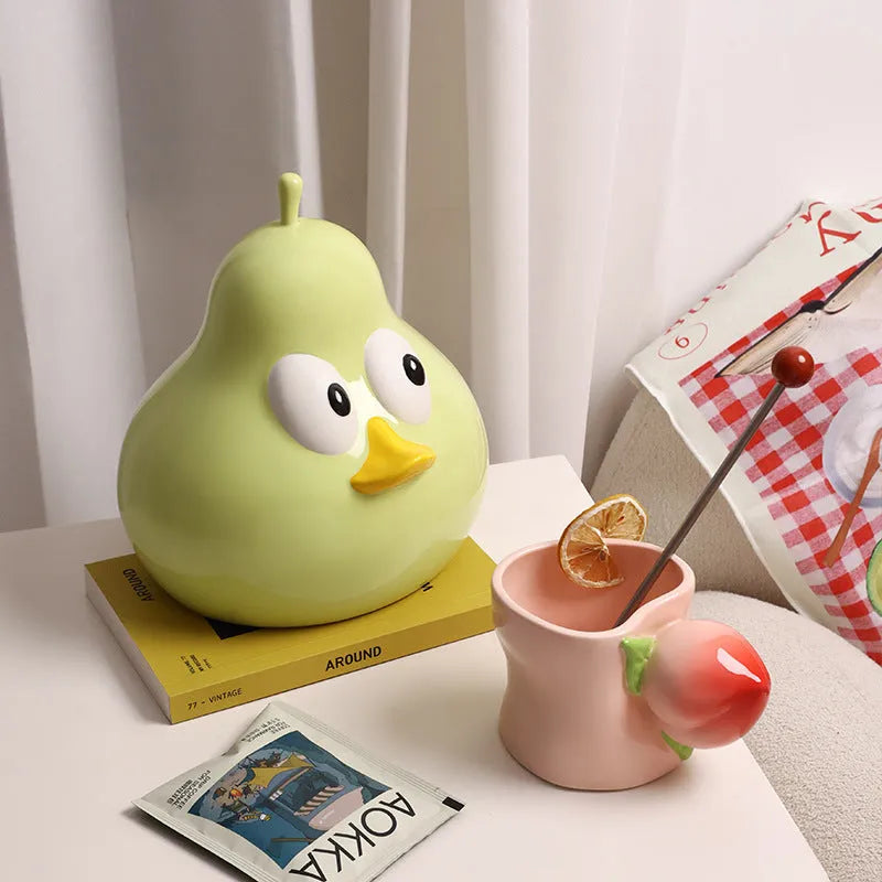 Ceramic pear-shaped tissue box holder with animal decoration in green colour