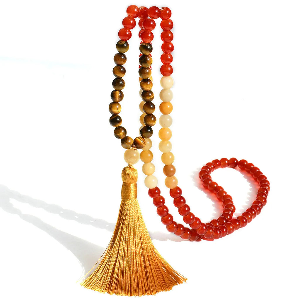 Long bohemian necklace with 108 natural stone beads, a geometric pendant, and a coloured tassel on a ball bead chain.