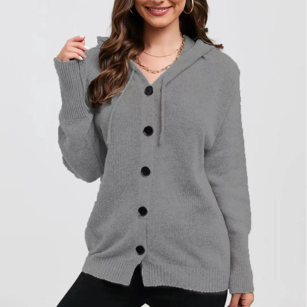 Woman wearing a loose fit, hooded, caramel-coloured cotton cardigan sweater with a textured pattern.