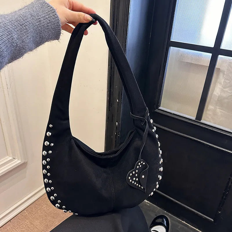 Strapless soft plush underarm tote handbag in a retro style, shown in one of its colour options.