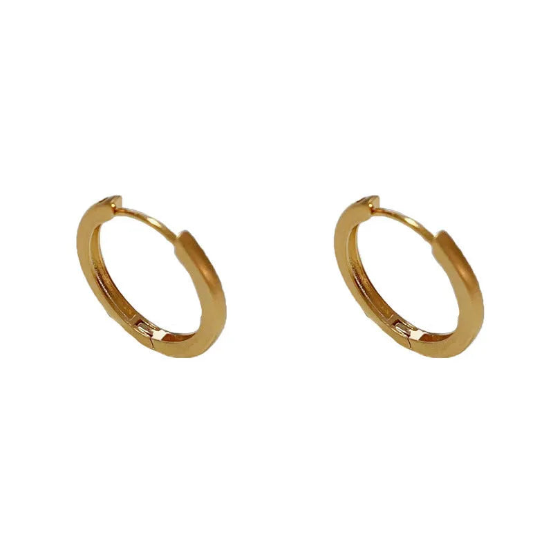 Geometric women's ear clip jewellery with simple eyelet design in gold or silver colour