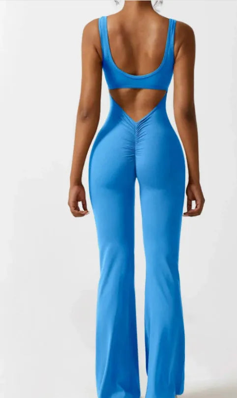 Black women's tight seamless yoga bodysuit with a mid waist and trousers length.